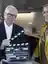 Chipperfield holds a film take board while standing next to Meike Krüger.