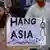 A supporter of Tehreek-e-Labaik Pakistan (TLP), a hardline religious political party holds a placard during a protest in Rawalpindi on October 12, 2018, demanding for hanging to a blasphemy convict Christian woman Asia Bibi