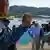 Police carry a dead body from an Acapulco beach