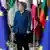 Ангела Меркель на фоне флагов ЕС