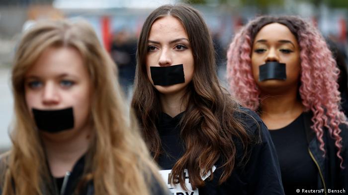 Activists take part in a 'Walk for Freedom' to protest against human trafficking in Berlin