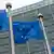 EU flags outside the European Commission in Brussels