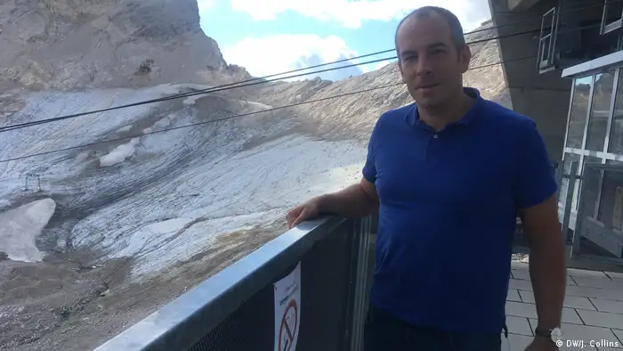 Scientist Michael Krautblatter stands in front of what's left of the Zugspitze glacier 