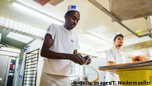 REUTLINGEN, GERMANY - OCTOBER 05: Trainee Anwar Albrnaoy refugee from Nigeria employed at Baeckerei Berger bakery is seen on October 5, 2018 in Reutlingen, Germany. The German government recently announced measures to help businesses fill vacant positions that include allowing rejected asylum applicants who have been granted permission to remain in Germany access to the labor market. Hundreds of thousands of job openings across Germany remain unfilled as businesses struggle to hire workers in a tight labor market. (Photo by Thomas Niedermueller/Getty Images)