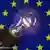 Лампа накаливания на фоне флага ЕС