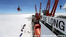 ABOARD XUELONG, Dec. 28, 2017 A helicopter transports goods and materials from China's research icebreaker Xuelong, or Snow Dragon, to Zhongshan station in the Antarctic, Dec. 28, 2017. Members of China's Antarctic expedition began to unload goods and materials from Xuelong to Zhongshan station in the Antarctic. Xuelong set sail from Shanghai, east China, on Nov. 8, beginning the country's 34th Antarctic expedition. wyo |