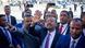 Ethiopian Prime Minister Abiy Ahmed surrounded by security personnel and waving to followers Ethiopian Prime Minister Abiy Ahmed surrounded by security personnel and waving to followers