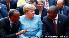 Rwanda's President Paul Kagame, German Chancellor Angela Merkel and South Africa's President Cyril Ramaphosa attend the G20 Compact with Africa Conference in Berlin, Germany, October 30, 2018. REUTERS/Axel Schmidt