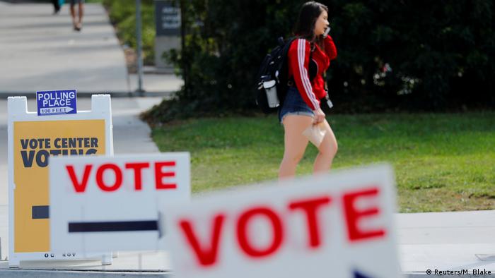 A young woman walks toward a polling place in Irvine, California
