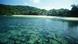 Micronesia, Palau, Pacific Resort set back of beautiful white sand beach, shallow coral reef visible in lagoon Micronesia, Palau, Pacific Resort set back of beautiful white sand beach, shallow coral reef visible in lagoon