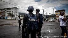 Cameroonian policemen patrol the market in the majority English-speaking South West province in Buea, on October 3, 2018. - The southwest, along with the northwest, has been torn by two-years of clashes between English-speaking fighters, who want to break away from majority francophone Cameroon, and government forces. (Photo by MARCO LONGARI / AFP) (Photo credit should read MARCO LONGARI/AFP/Getty Images)