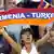 Football fan with an Armenia-Turkey banner