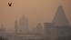 Temples and buildings are shrouded in smog (picture-alliance/NurPhoto/N. Kachroo)