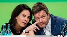 LEIPZIG, GERMANY - NOVEMBER 10: Robert Habeck and Annalena Baerbock, the two co-leaders of the German Greens Party (Buendnis 90/Die Gruenen) react on stage at a Greens Party federal congress ahead of next year's European parliamentary elections on November 10, 2018 in Leipzig, Germany. The party is meeting over policy issues ahead of the elections that are to take place May 23-26, 2019. (Photo by Jens Schlueter/Getty Images)