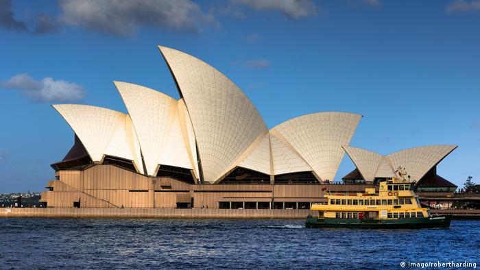 A Sydney Harbour ferry passes the Sydney Opera House on its way to Circular Quay.