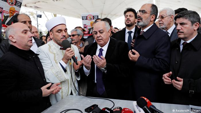 Men gather at the symbolic funeral service for murdered journalist Jamal Khashoggi in the Fatih Mosque courtyard in Istanbul. (Reuters/M. Sezer)