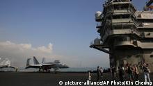 Journalists tour the deck of the U.S. Navy USS Ronald Reagan aircraft carrier in Hong Kong, Wednesday, Nov. 21, 2018. The USS Reagan docked in Hong Kong on Wednesday, days after a pair of American B-52 bombers flew over the disputed South China Sea. (AP Photo/Kin Cheung) |