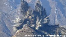 A North Korea's guard post in the demilitarized zone is blown up in this picture taken from South Korea's territory, November 20, 2018. The Defense Ministry/Yonhap via REUTERS ATTENTION EDITORS - THIS IMAGE HAS BEEN SUPPLIED BY A THIRD PARTY. SOUTH KOREA OUT. NO RESALES. NO ARCHIVE. TPX IMAGES OF THE DAY