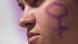 A protester seen with a feminist symbol painted on her face A protester seen with a feminist symbol painted on her face