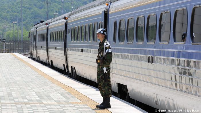 A South Korean soldier stands guard at the Dorasan railway station, the last South Korean station linked to a cross-border railway between Seoul and Pyongyang, near the Demilitarized zone dividing the two Koreas in Paju on May 26, 2009