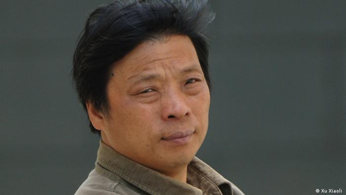 Lu Guang in a collared shirt 