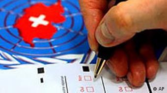 A Swiss voter making a selection