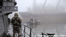 Ukrainian soldier stands guard aboard military boat called Dondass moored in Mariupol, Sea of Azov port on November 27, 2018. - Three Ukrainian navy vessels were seized off the coast of Crimea by Russian forces, which fired on and boarded Kiev's ships after several tense hours of confrontation. Here's what is known about Sunday's incident. (Photo by Sega VOLSKII / AFP) (Photo credit should read SEGA VOLSKII/AFP/Getty Images)