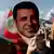 أنصار حزب الشعوب الديمقراطي يرفعون شعار الحزب مع صورة لصلاح الدين دميرتاش، زعيم الحزب المعتقل (صورة رمزية: يونيو/ حزيران 2018)
