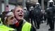 Protester wearing yellow vests cry as they face off with police during a demonstration in central Brussels Protester wearing yellow vests cry as they face off with police during a demonstration in central Brussels