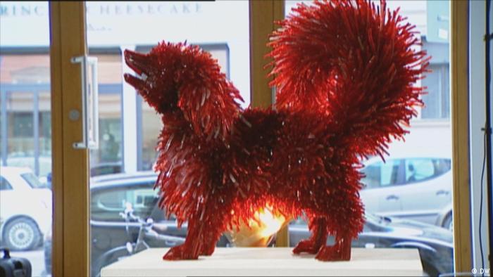 A glass dog sits in the window (DW)