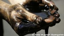 GERMANY - JANUARY 24: saber rattling - icon image for the Iran conflict, Our picture shows oil that drips from his hands in the form of a bomb, [M] (Photo by Ulrich Baumgarten via Getty Images)