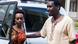 A man stands next to Diane Rwigara as she steps out of a car A man stands next to Diane Rwigara as she steps out of a car