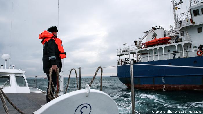The coast guard checks a vessel in the Kerch Strait