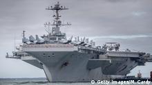 PORTSMOUTH, ENGLAND - OCTOBER 08: The US warship USS Harry S. Truman is pictured anchored in The Solent on October 8, 2018 near Portsmouth, England. The nuclear powered aircraft carrier, named after the 33rd President of the United States with a crew of more than 5,000, has been at sea since late August and has been on operations in the North Atlantic, Mediterranean and Arabian Gulf. The Nimitz-class ship, launched in 1998 and carries more than 70 helicopters and fixed-wing aircraft, arrived in The Solent on Saturday for a five-day stay. (Photo by Matt Cardy/Getty Images)