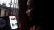 A woman tries to tweet with a smartphone in Lagos A woman tries to tweet with a smartphone in Lagos