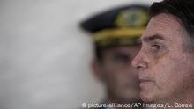 Dec. 1, 2018.
Brazil's President-elect Jair Bolsonaro listens to a question during a press conference after the Army cadets graduation ceremony at the Military Academy of Agulhas Negras in Resende, Brazil, Saturday, Dec. 1, 2018. Bolsonaro will be sworn in as Brazil's next president on Jan. 1. (AP Photo/Leo Correa) |