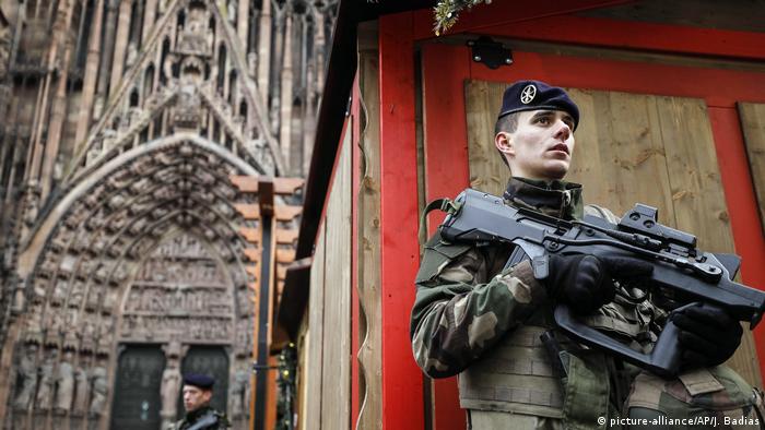 Soldier in Strasbourg stands guard at the closed Christmas market, where the shooting took place