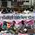 Indien, Dhaka: Journalisten halten Banner und Plakate, während sie vor dem Presseclub gegen das kürzlich verabschiedete Gesetz zur digitalen Sicherheit protestieren
