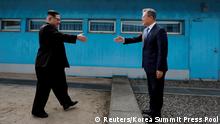 South Korean President Moon Jae-in and North Korean leader Kim Jong Un shake hands at the truce village of Panmunjom inside the demilitarized zone separating the two Koreas, South Korea, April 27, 2018. Korea Summit Press Pool/Pool via Reuters SEARCH POY GLOBAL FOR FOR THIS STORY. SEARCH REUTERS POY FOR ALL BEST OF 2018 PACKAGES. TPX IMAGES OF THE DAY.