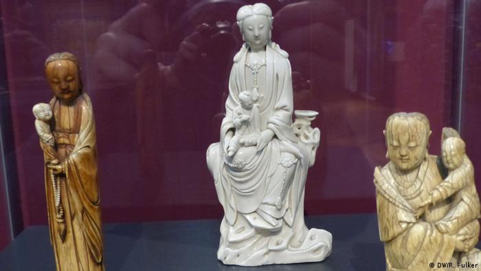 Three carvings depict women holding children (DW/R. Fulker)