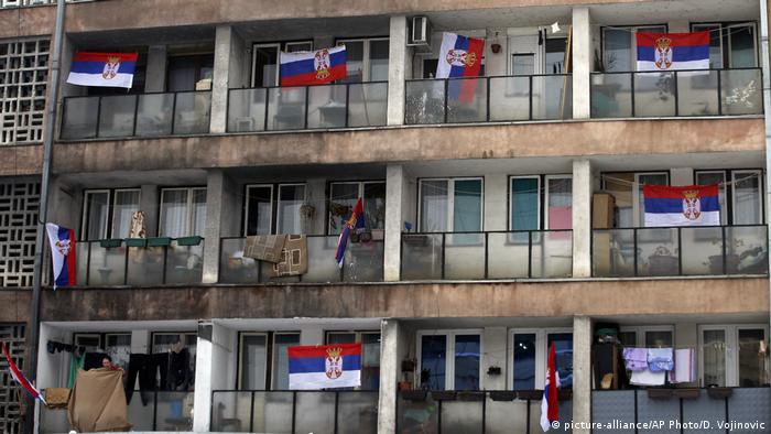 Serbian population in Kosovo's north flying Serbia flags off their balconies