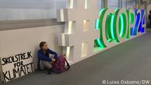 14.12.2018 Fifteen-year-old activist Greta Thunberg has been taking part in Friday school strikes as part of a campaign to get people to take action against climate change. Description: Greta Thunberg sits next to the COP24 sign with a sign that says, school strike for climate