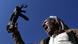 A Houthi loyalist raises his gun in the air A Houthi loyalist raises his gun in the air