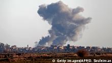 Smoke billows after bombings in the Deir Ezzor province, near Hajin, eastern Syria, on December 15, 2018. - Kurdish-led forces seized the Islamic State's main hub of Hajin on December 14, a milestone in a massive and costly US-backed operation to eradicate the jihadists from eastern Syria. The Syrian Democratic Forces secured Hajin, the largest settlement in what is the last pocket of territory controlled by IS, the Syrian Observatory for Human Rights said. (Photo by Delil SOULEIMAN / AFP) (Photo credit should read DELIL SOULEIMAN/AFP/Getty Images)