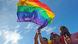 Singaporeans holding up rainbow flag Singaporeans holding up rainbow flag