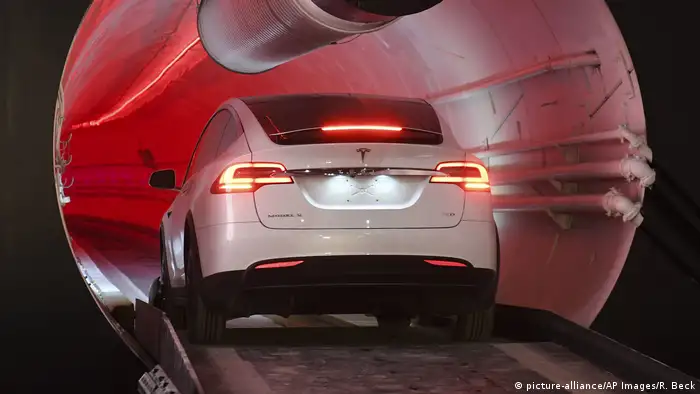 A hyperloop tunnels with a Tesla car in it
