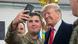 Soldier taking photo with Trump Soldier taking photo with Trump