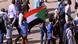 Sudanese people protesting, waving flag Sudanese people protesting, waving flag