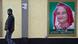 A man walks past a portrait of Bangladesh Prime Minister Sheikh Hasina A man walks past a portrait of Bangladesh Prime Minister Sheikh Hasina