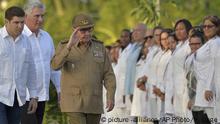 Cuba's First Secretary of Communist Party Raul Castro, center, and President Miguel Diaz-Canel, second left, arrive to Santa Ifigenia Cemetery to commemorate the 60th anniversary of the Revolution in Santiago de Cuba, Cuba, Tuesday, Jan. 1, 2019. (Yamil Lage/Pool Photo via AP) |